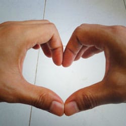 Hands showing heart and care