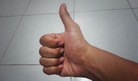 thumbs up for doing well in business