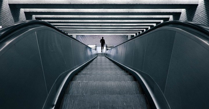 businessman on escalator